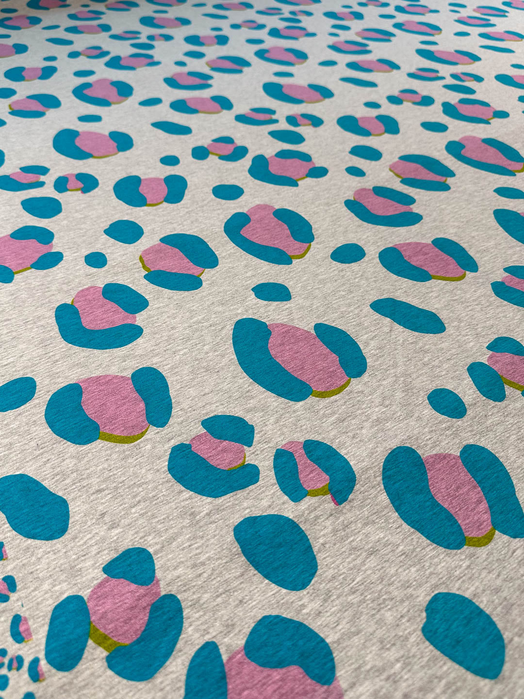 French Terry Leo Excentric melange light petrol extrabreit